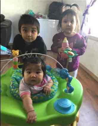 Ireland, back left, Aubree, with bottle, and Amber, along with their mother, Faith Strang, and five other family members died in a fire on the Indian reserve at Pikangikum in northern Ontario