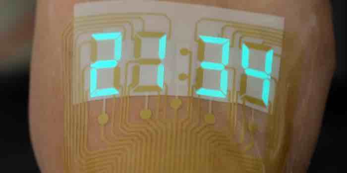 A stretchable stopwatch lights up human skin
