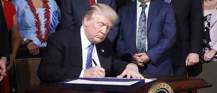 Time for people to die as America is destroyed: Trump just signed the tax cut bill into law