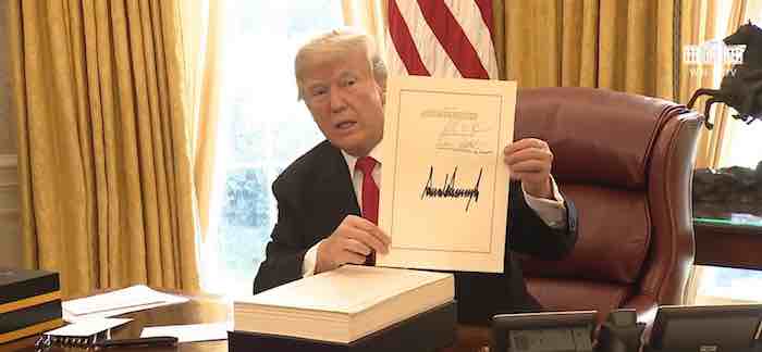 Trump signs bill cutting taxes, ending Obamacare individual mandate