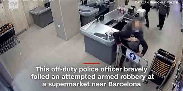 An officer in Spain sprung to action at a supermarket near Barcelona when he realized an armed robbery was afoot