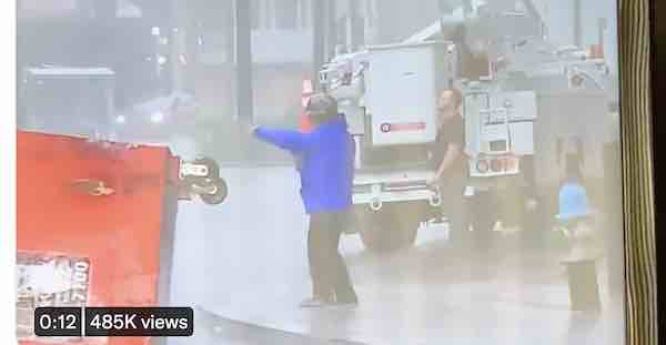 Utility crew video bombs Jim Cantore
